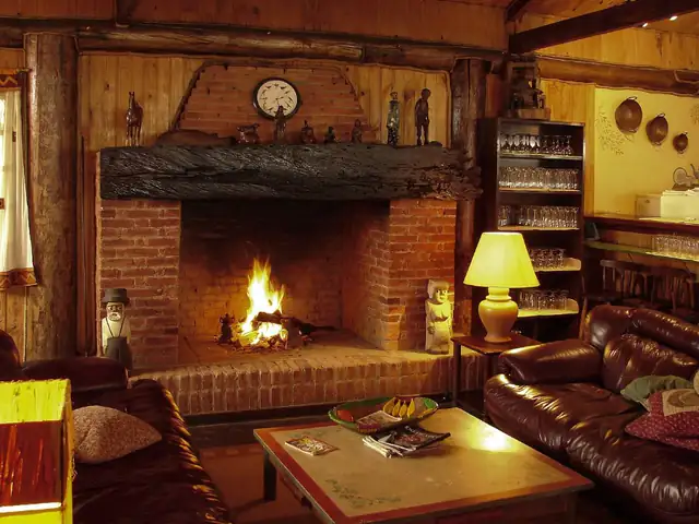 Traditional brick fireplace, Newcastle upon Tyne Traditional brick fireplace with a log fire in a cosy living room